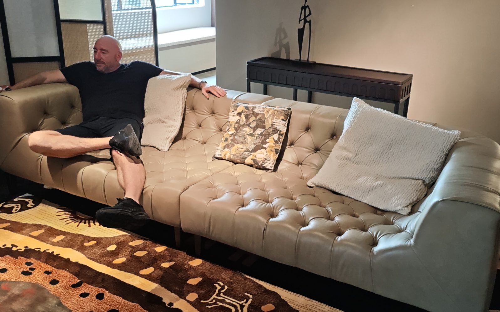 Source From Foshan team reviewing furniture with clients in a Foshan showroom